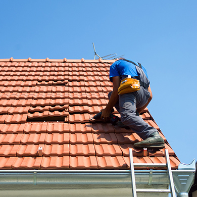 a man fixing a roof